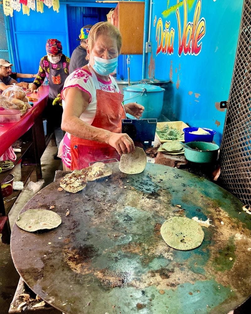 woman making street food in mexico | dona vale oaxaca netflix