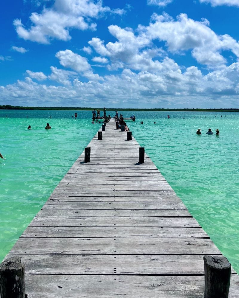 wooden dock going out to laguna kaan luum lagoon in tulum mexico