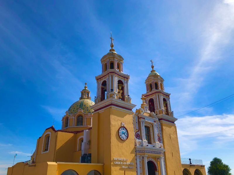 yellow colonial church in cholula mexico