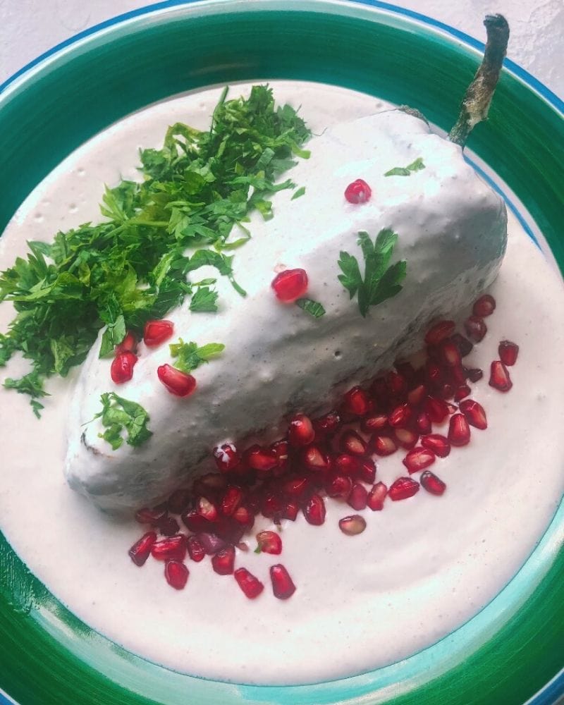 red white and green dish called chile en nogada, the national dish of mexico