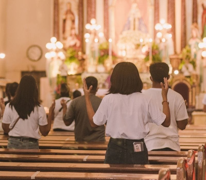 people at catholic christmas mass | mexico winter holidays