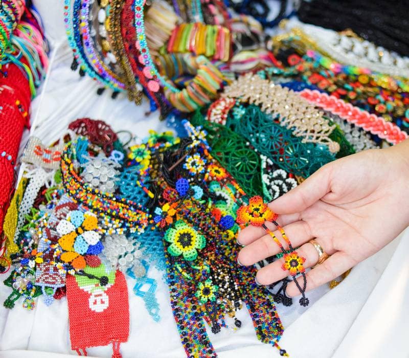 girl holding Mexican handricrafts