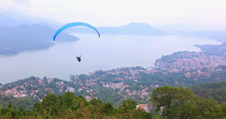 paraglider over a lake, one of the best things to do in valle de bravo mexico