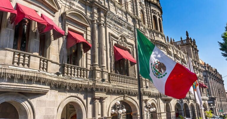 Mexican flag waving in front of Puebla town hall