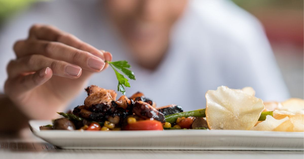 chef plating at one of the michelin star restaurants mexico has