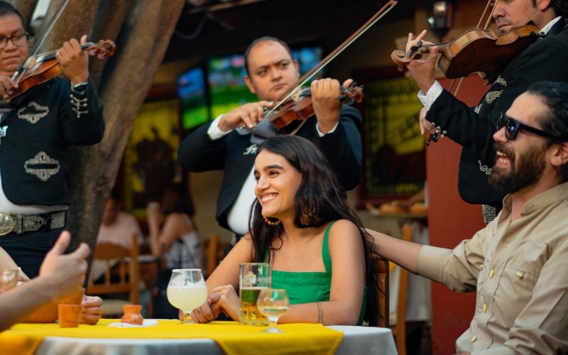 mariachi band serenading couple