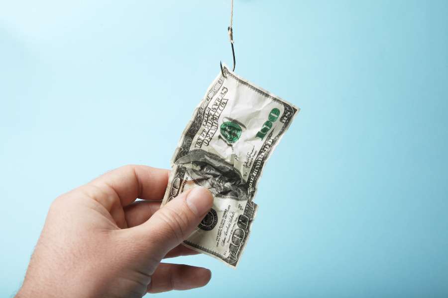 man holding us dollar bill