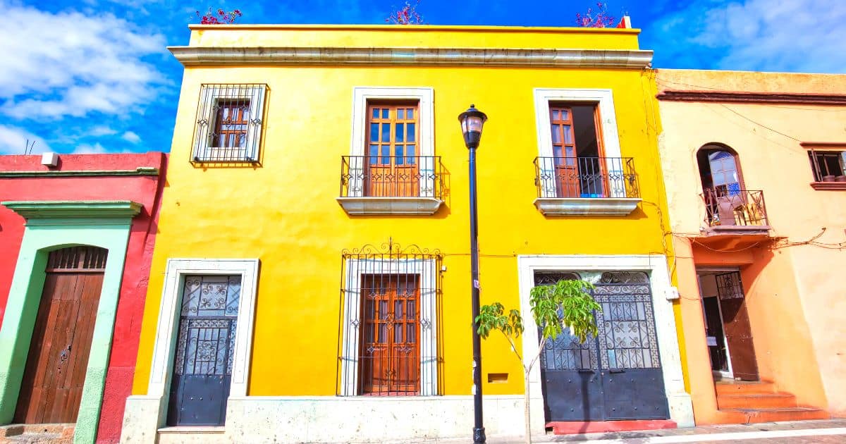 yellow colonial building | best places to stay in oaxaca hotels
