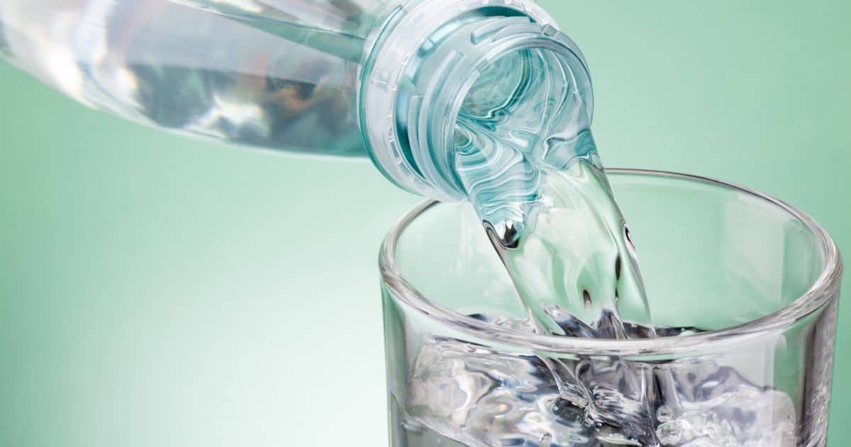 pouring oaxaca water into a cup