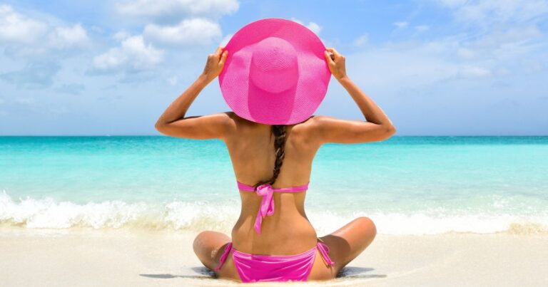 woman in bright pink bikini, one of her playa del carmen outfits