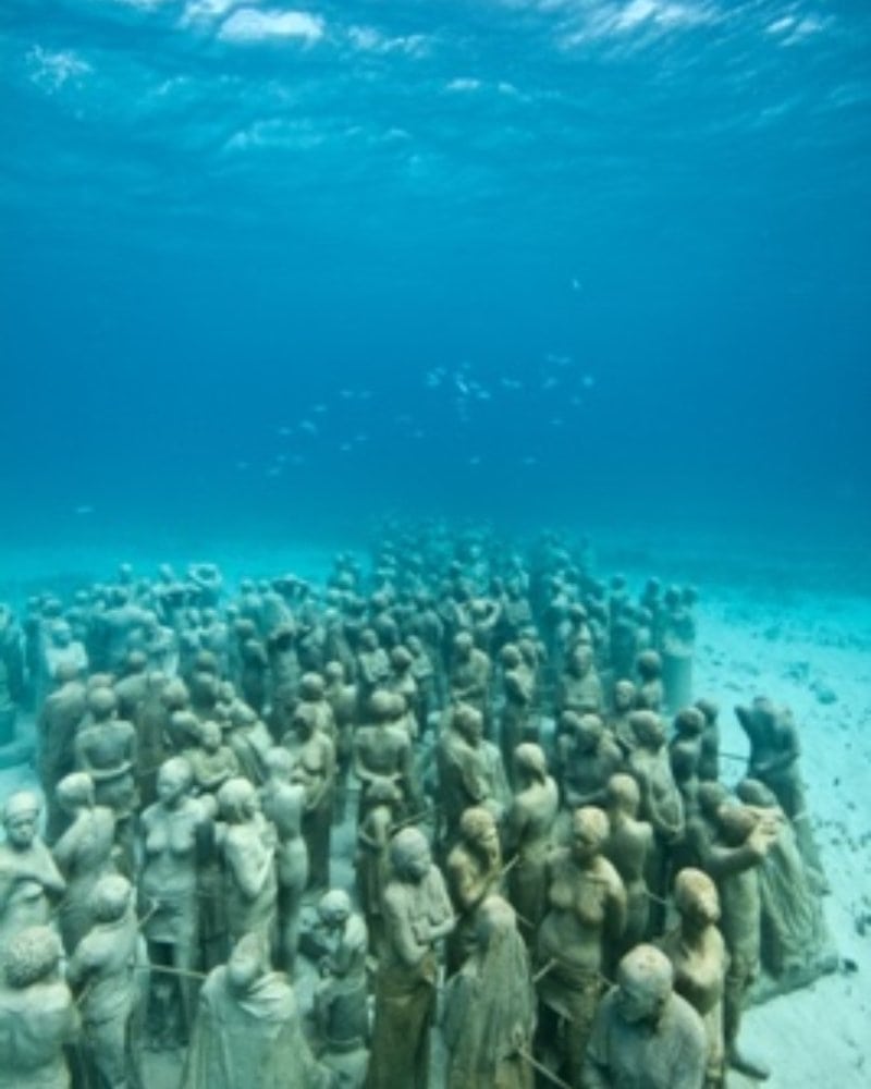 sculpture of silent evolucation underwater museum in Mexico