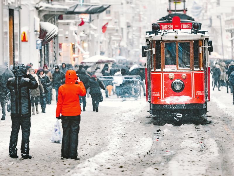red trolley on a snowy street in Istanbul