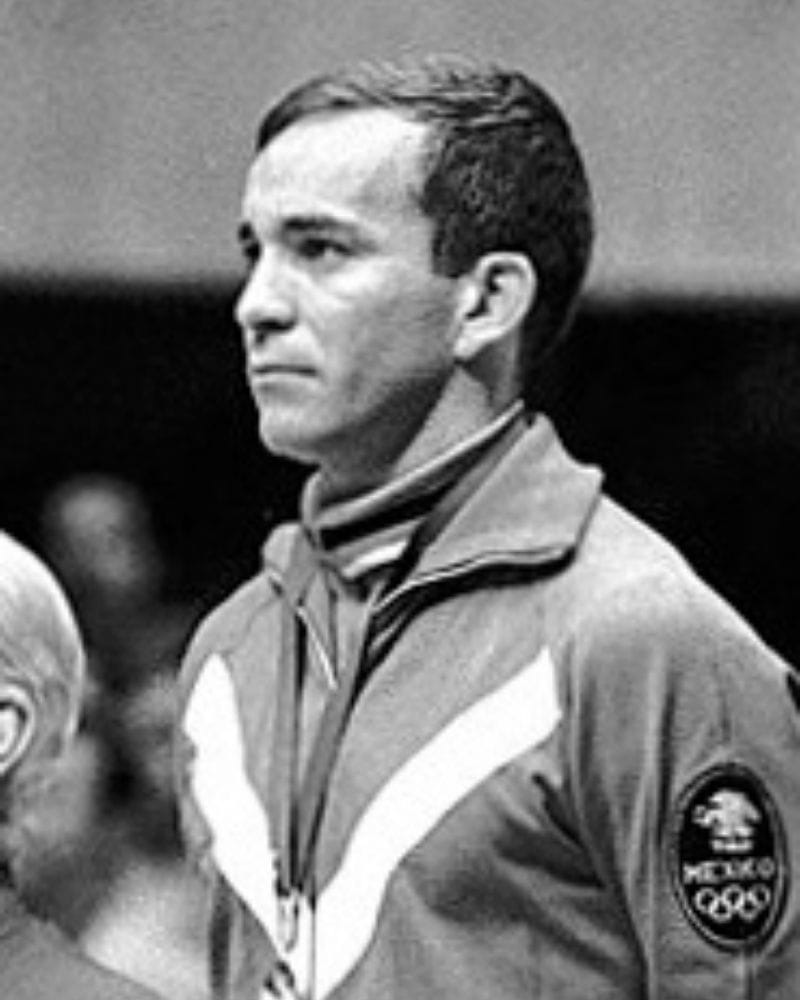 Mexican diver Alvaro Gaxiola receiving his silver medal on the podium at the Olympic Games