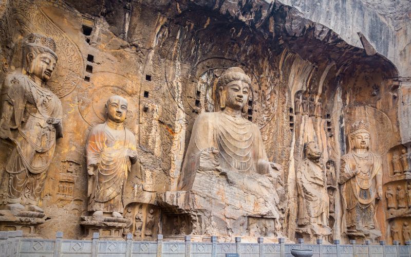 Buddhist figures carved into rock