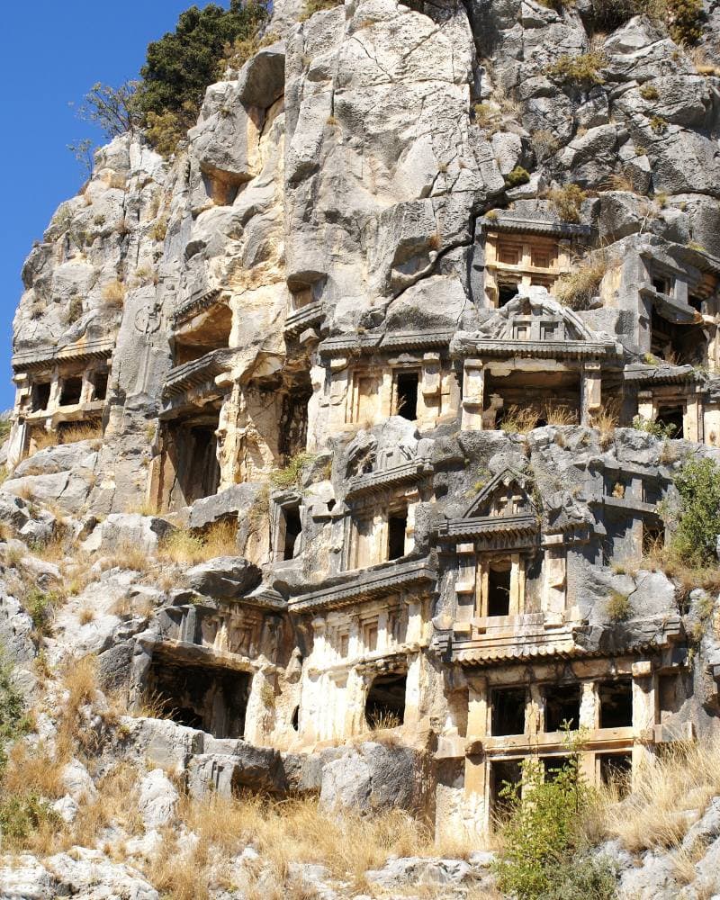 rock hewn tombs carved in a cliff, lycian toms in turkey