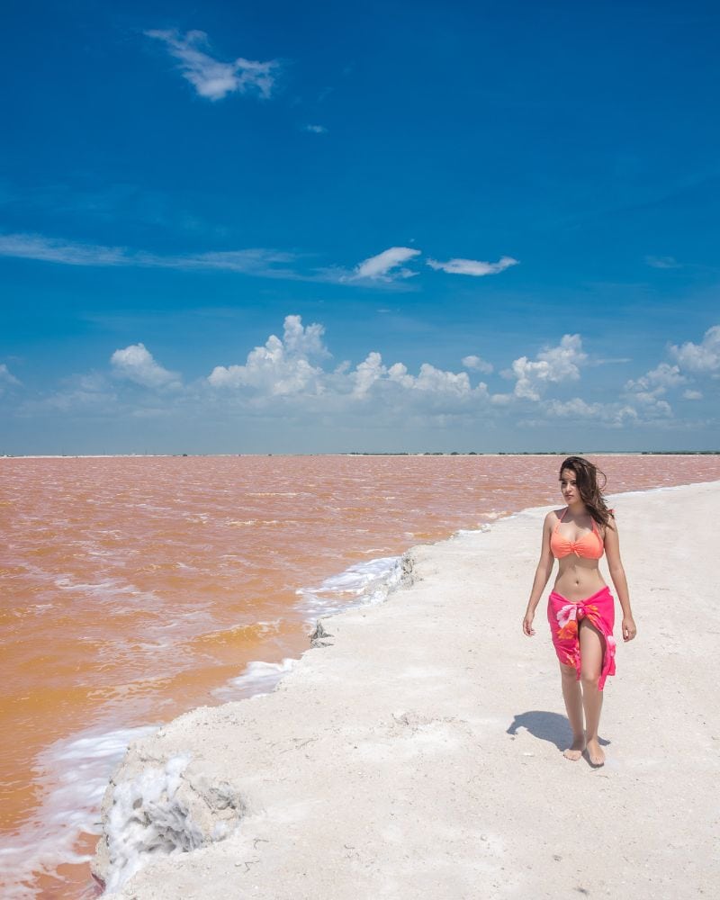woman wearing pink bikini posing at pink lakes mexico