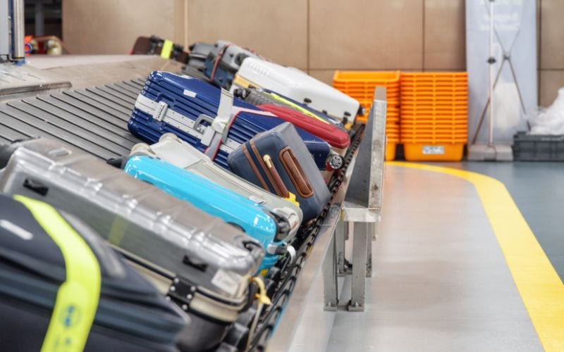 luggages being scanned in the airport