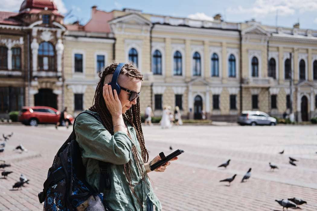 woman with headphones in the square