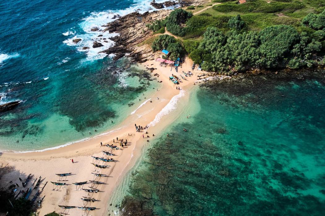 Aerial view of blue beach island. Drone view of the beaches of Sri Lanka