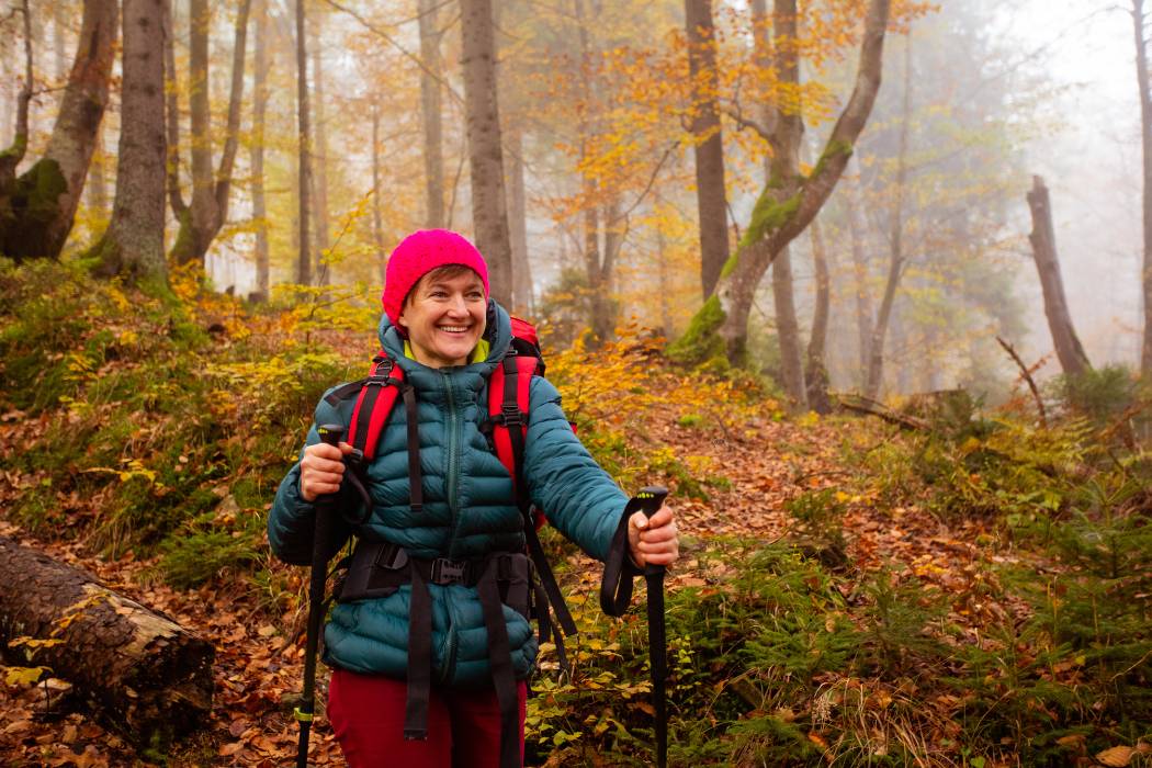 woman hiking through the forest