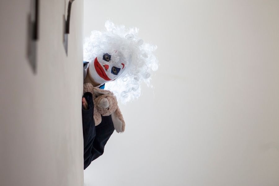 Scary evil clown boy