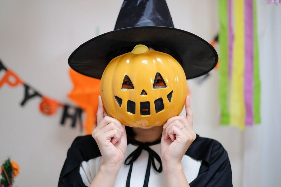 Woman wearing Halloween mask