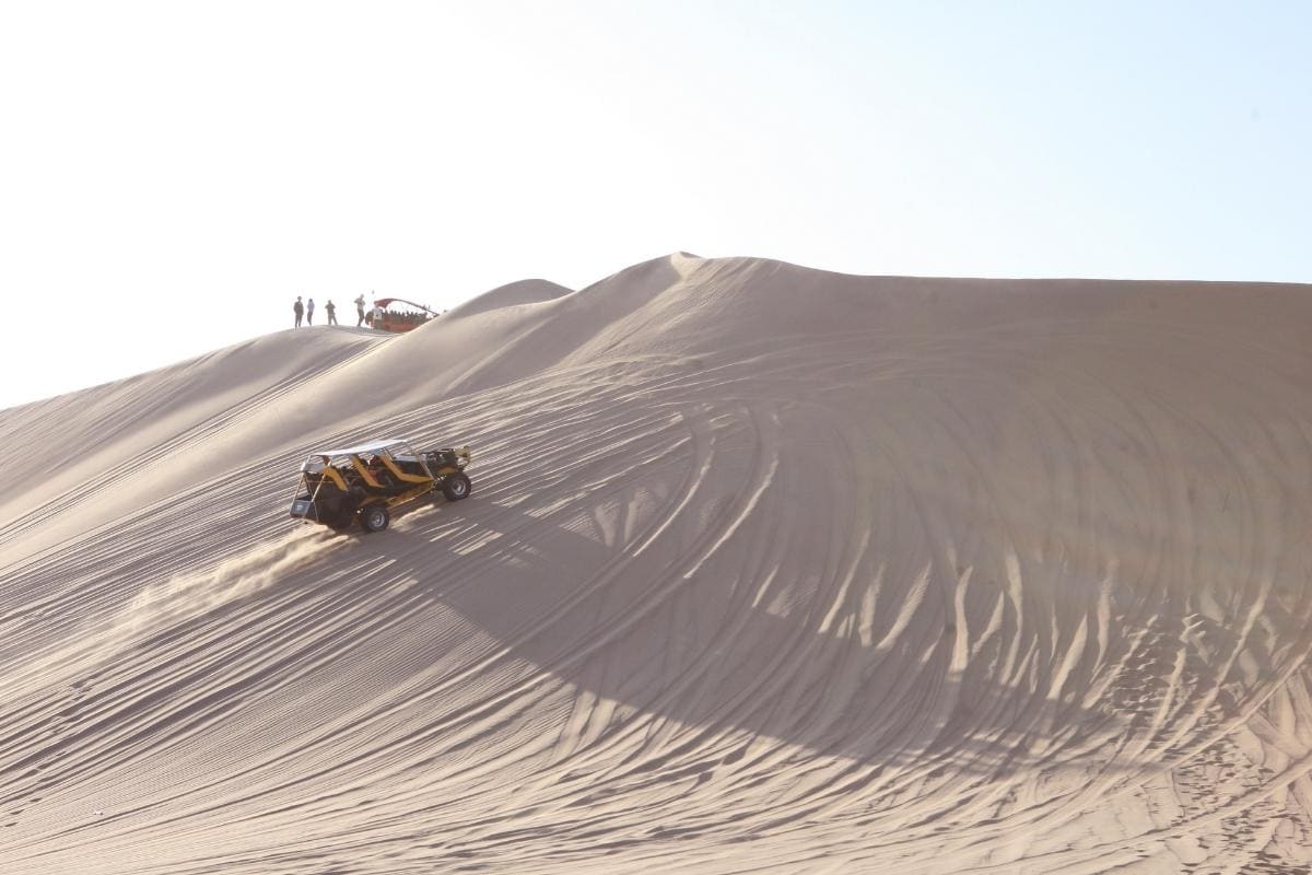 Sandboarding in the Dunes of Huacachina, Peru
