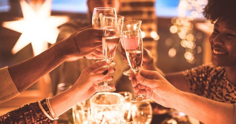 friends doing a champagne toast during a mexico new year's celebration