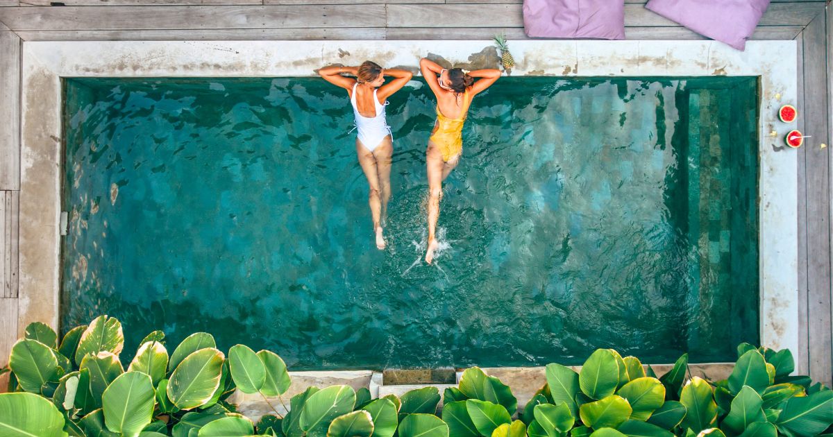 two people in the pool at one of the most expensive mexico airbnbs