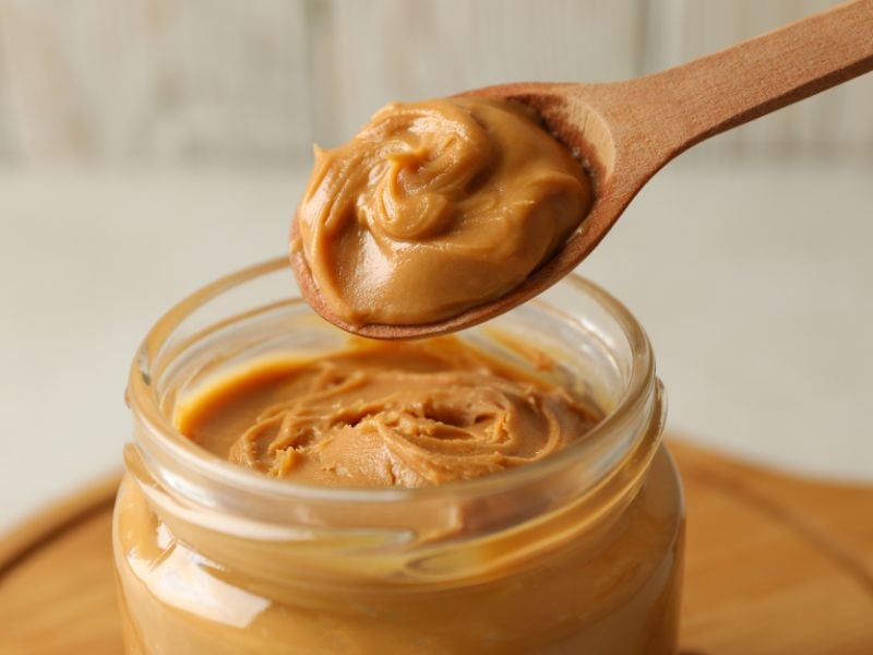 spoon in jar of peanut butter