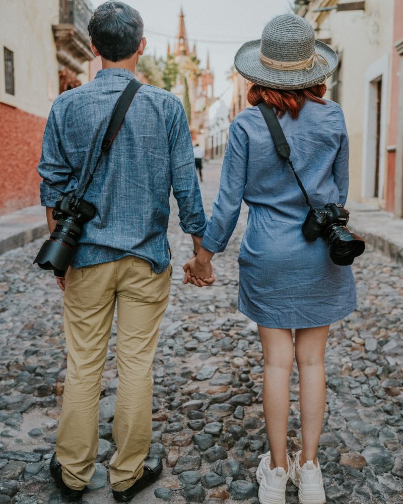 couple holding hands in the street in san miguel de allende mexico