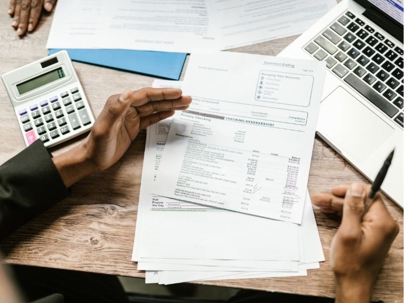 man looking over bank statement