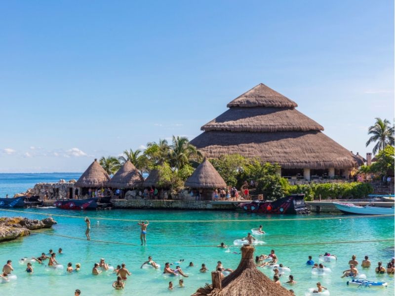 people swimming at xcaret mexico waterpark