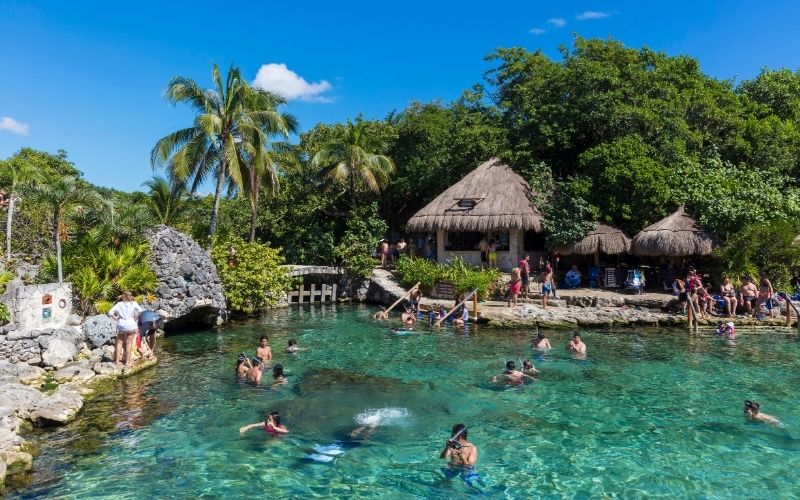 people swiming and snorkeling at scaret park mexico
