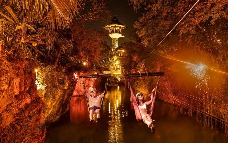 couple on zipline at xplor fuego xcaret park