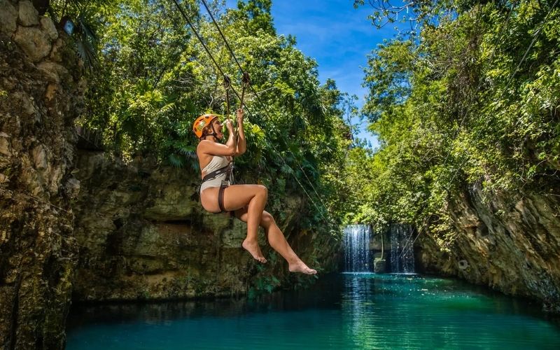 woman on zipline at xplor xcaret park