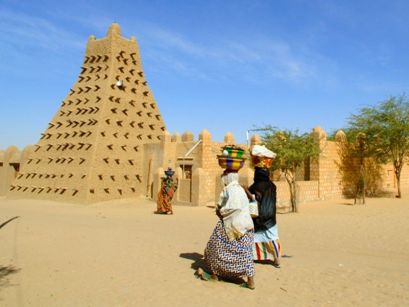 people walking to Djinguereber Mosque in Timbuktu, Mali