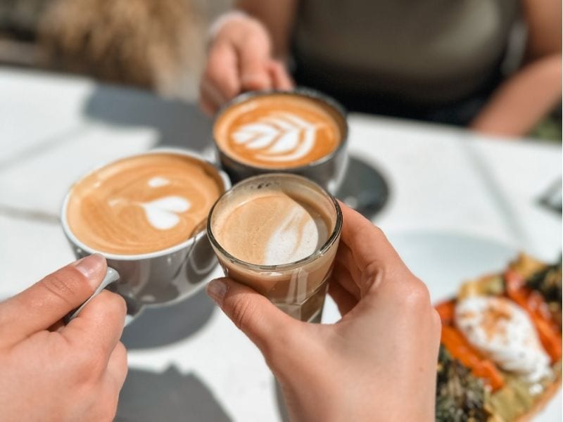 coffee latte cheers at a cafe