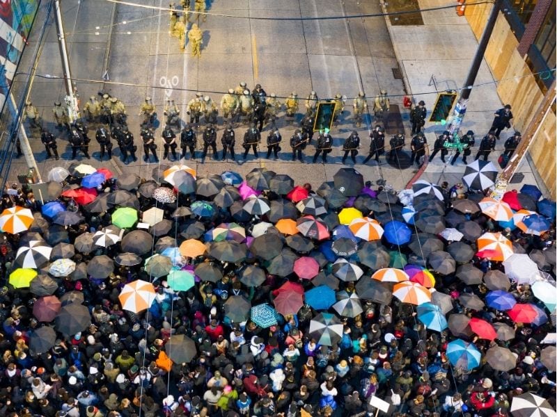 protestors and police, opposite each other