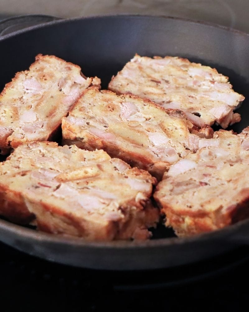 scrapple frying in a pan