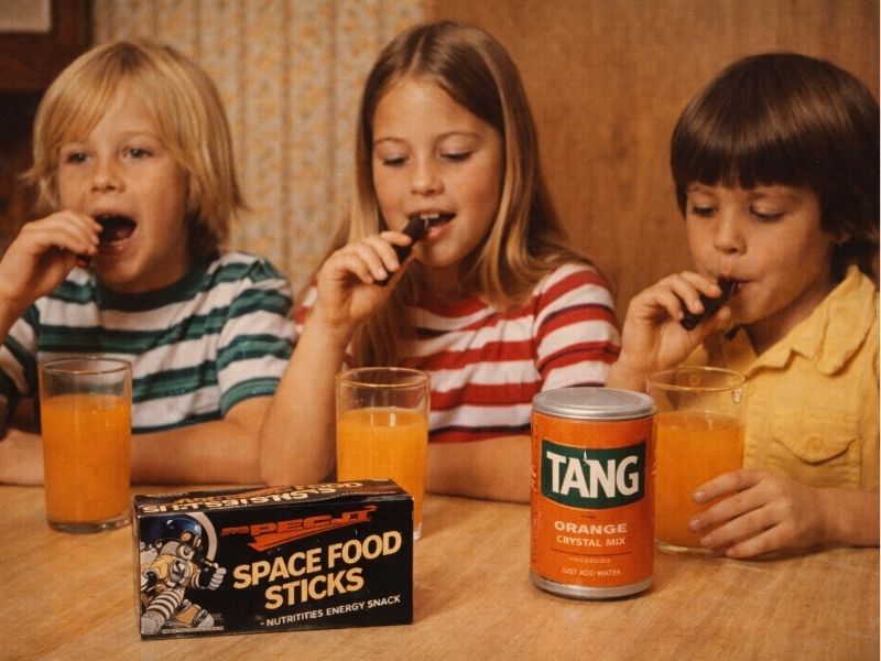kids in the 1970s eating NASA's space food sticks and drinking Tang