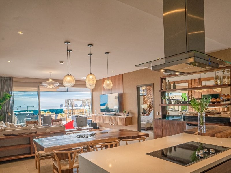 Open kitchen and dining area with ocean views at the 3-Bedroom Condo with Arch Views in El Tezal, Cabo San Lucas