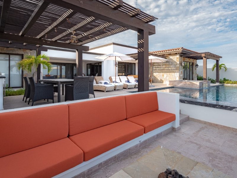 Shaded lounge and infinity pool at Casa Alvar, an ocean-view villa in Quivira, Cabo San Lucas