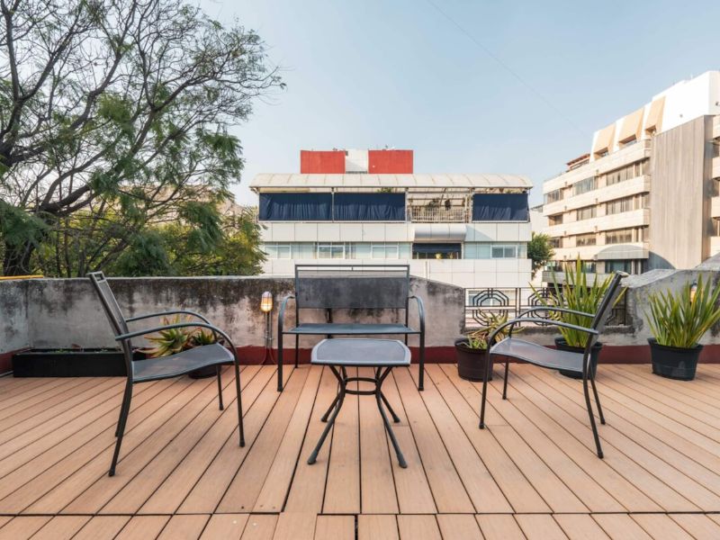 Sunny rooftop terrace with patio chairs at Casa Boris near Reforma Avenue in Cuauhtémoc, Mexico City