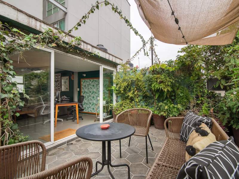 Plant-filled private patio at Casa Chaya, a Mexico City Airbnb in Roma Norte