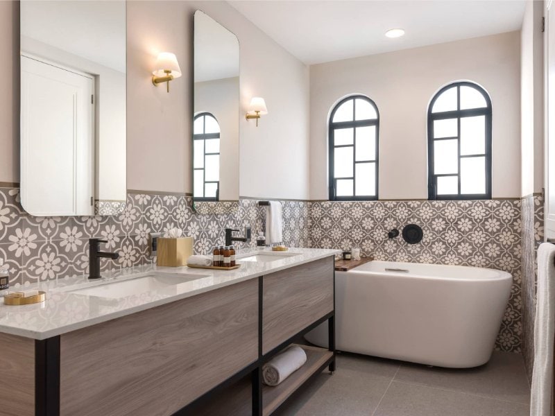 Marble bathroom with a deep soaking tub at Casa Cleo in Condesa, a Mexico City luxury rental
