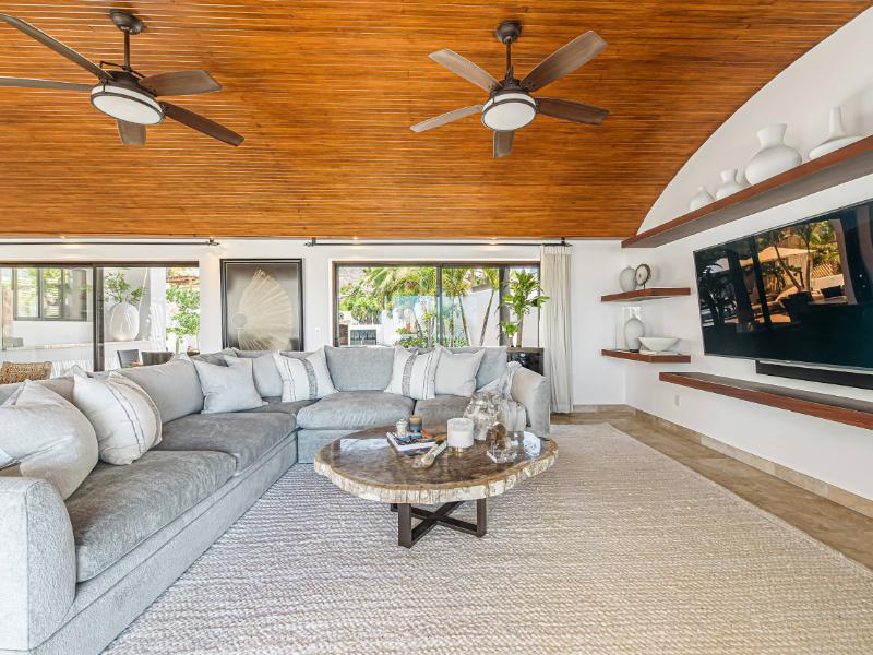 Covered veranda living room with a big sectional at the 4-Bedroom Pedregal Villa in Cabo San Lucas