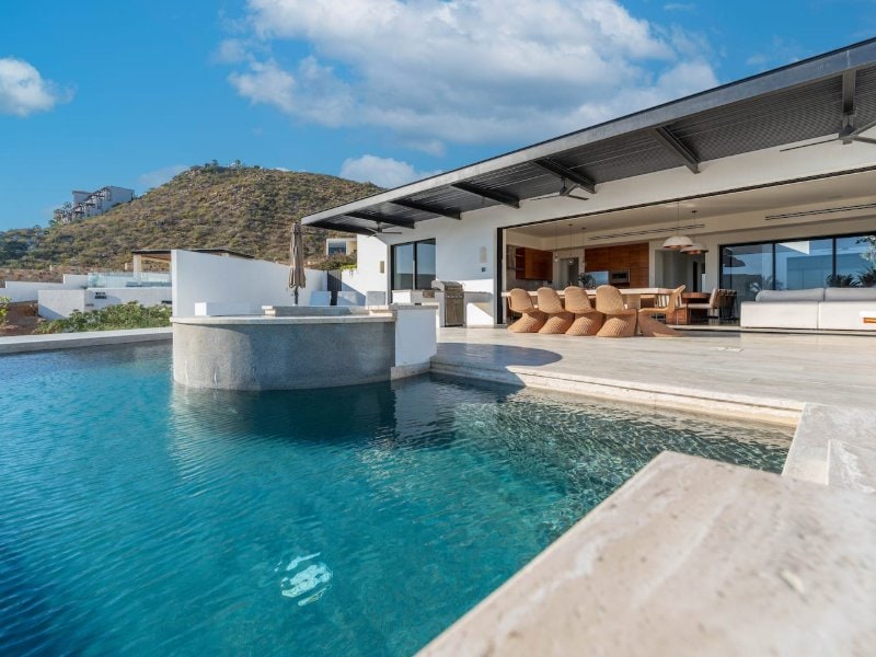 Infinity pool and open-air living area at Casa La Chula in Pedregal, Cabo San Lucas