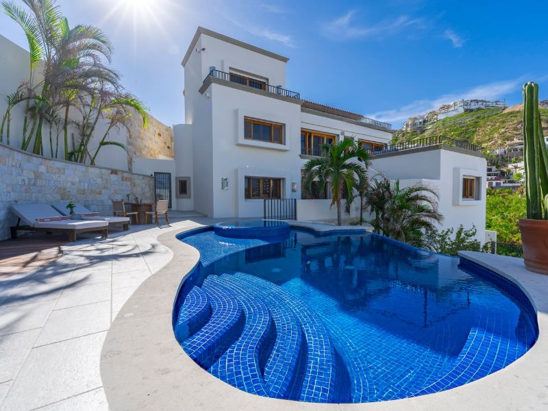 Pool and multi-level white villa at Casa La Piñata in Pedregal, Cabo San Lucas