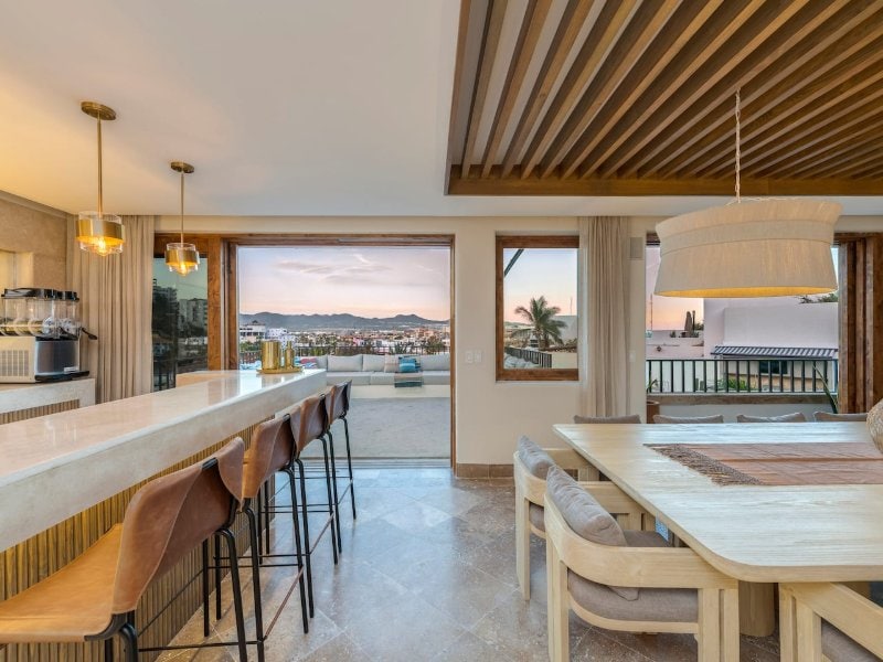 Kitchen bar and dining area with views over Cabo at Casa La Piñata in Pedregal, Cabo San Lucas